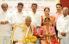 Rajyotsava Award winner Jaya Suvarna honoured at Kudroli Temple